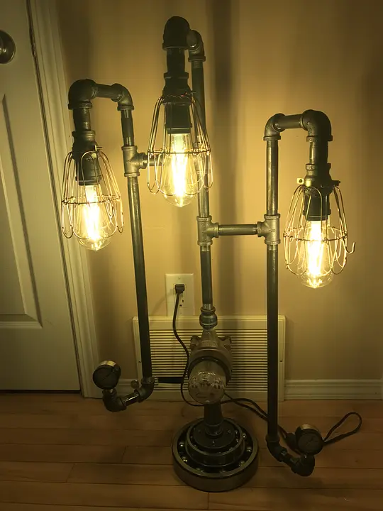 Industrial-style lamp with Edison bulbs and metal piping